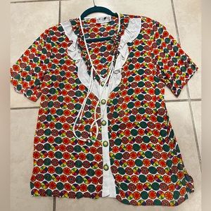 Psychedelic button up top! SCREAMS #Pride. Snag this up before it’s gone.